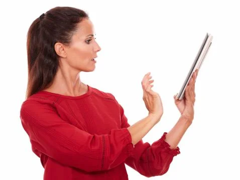 Attractive young lady using her tablet pc Stock Photos
