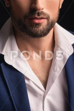 Attractive young man with beard in suit Stock Photos