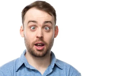 Attractive young man with a comic expression Stock Photos