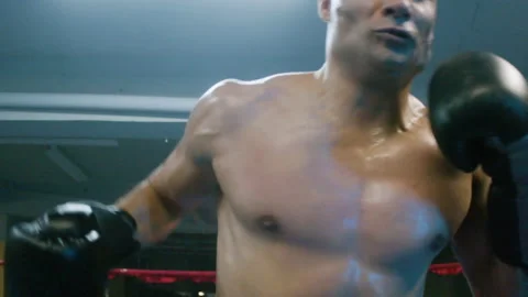 Attractive young man doing shadow fight towards camera Stock Footage 181798876