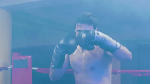 Attractive young man doing shadow fight towards camera Stock Footage 181803030