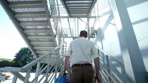 Attractive young man with high security bulletproof protected case climbing mode Stock Footage 137540580