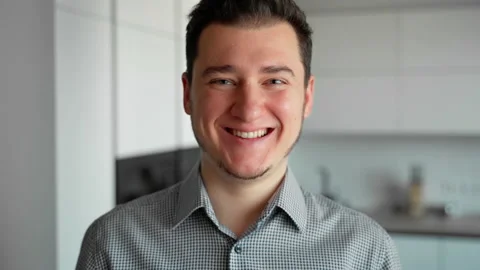 Attractive young man looking at camera. Person happy client Stock Footage 153055722