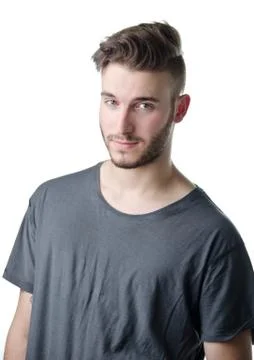Attractive young man looking in camera with nice, cute expression Stock Photos