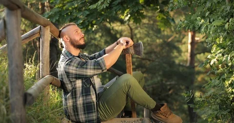 Attractive young man looking up the sky and thinks about the future in nature at Stock Footage 126497901