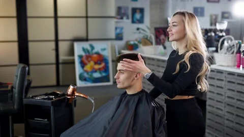 Attractive young man is a regular customer of a premium beauty salon Stock Footage 236398559