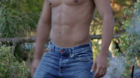 Attractive Young Man Shirtless Dancing by Fire Stock Footage 58016288