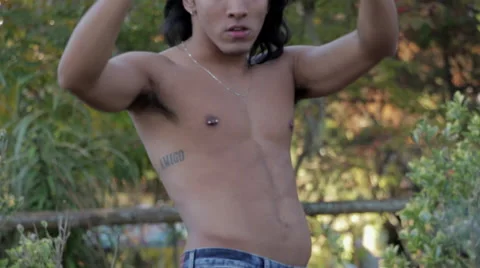 Attractive Young Man Shirtless Dancing by Fire Stock Footage 58016312