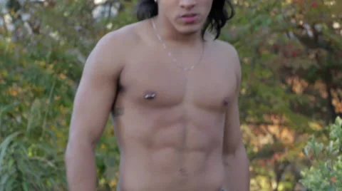Attractive Young Man Shirtless Dancing by Fire Stock Footage 58016361