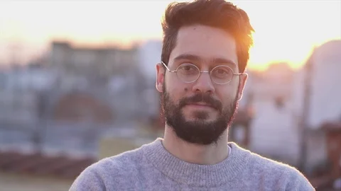 Attractive Young Man Smiling wearing Glasses,  On Rooftop of a building at Su Video stock 106724315