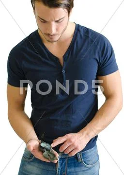 Attractive young man standing with compass in his hand Stock Photos
