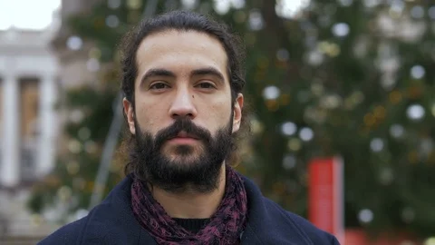 Attractive young man staring at camera in the city,Christmas Time Stock-Footage 116433044