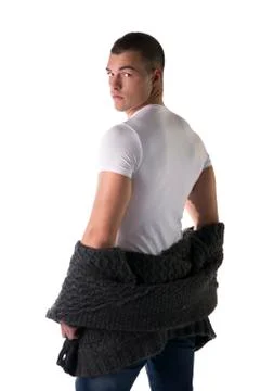 Attractive young man taking off wool sweater Stock-Fotos
