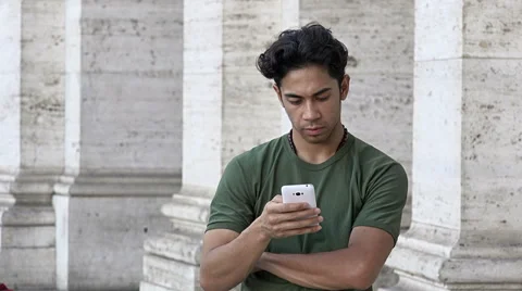 Attractive young man using cell phone in the city Video stock 66680327