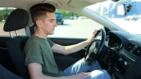 Attractive Young Man Using Mobile Phone Sitting In Car Stock Footage 123695886