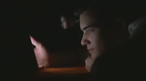 Attractive young man using a smart phone in bed Stock Footage 61633825