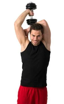 Attractive young man working out with weights Stock Photos
