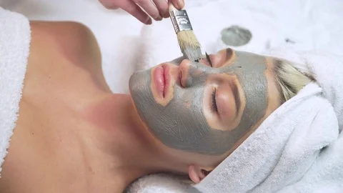 Attractive young model face mask spa skin care beautiful woman female Stock Footage 76300028