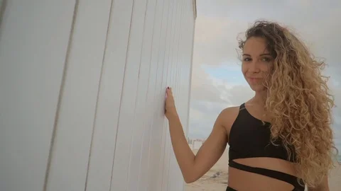 Attractive young model outside on beach. Video stock 94623262