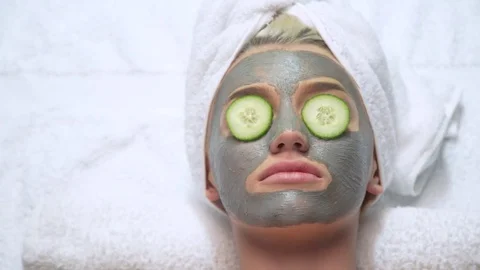 Attractive young model spa skin care cucumber towel relaxed beautiful woman 스톡 동영상 76300188