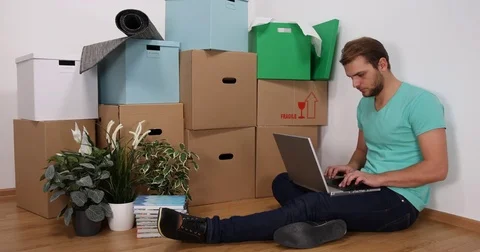 Attractive Young Single Man Use Computer Laptop Work Home Online in Living Room Stock Footage 77022757