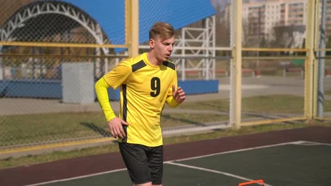Attractive Young Soccer Player Doing Dynamic Warm Up For Football Training. Stock Footage 152081535