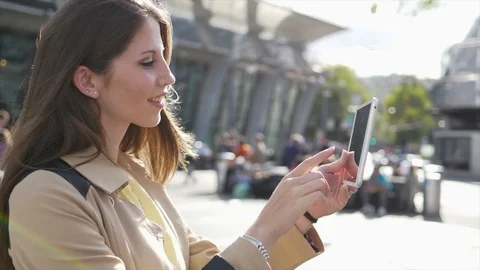 Attractive Young Stylish Female Using Tablet Screen Computer in the City Stock Footage 90597982