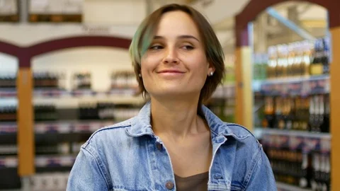 Attractive young woman look ar camera smiling feel happy in mall Stock Footage