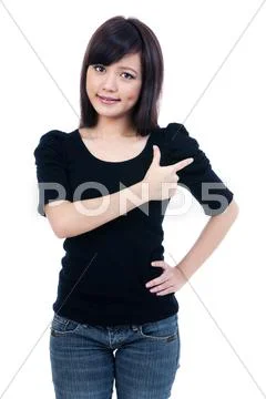 Attractive young woman pointing at copy space Stock Photos