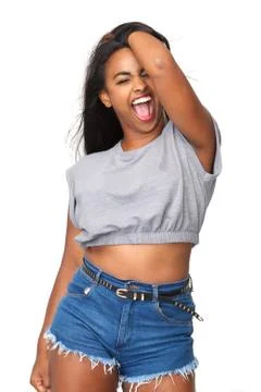 Attractive young woman shouting with hand in hair Stock Photos