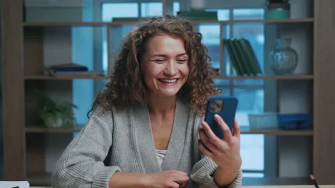 Attractive Young Woman Talking on Online Video Call at Smartphone in Home Stock Footage 166375623
