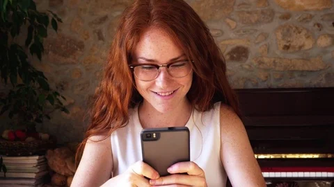 Attractive young woman using Iphone smartphone texting smile close up laugh 4k Stock Footage 77768445
