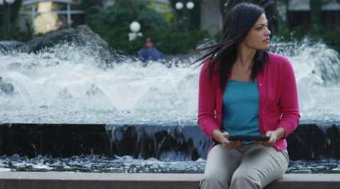 Attractive Young Woman Using Tablet By Fountain Stock Footage 37181060