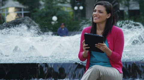 Attractive Young Woman Using Tablet By Fountain Stock Footage 37181071