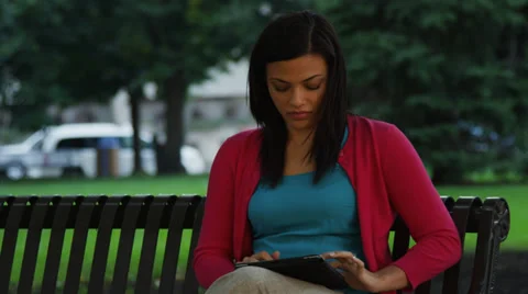 Attractive Young Woman Using Tablet In Park Stock Footage 37181085