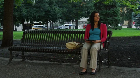 Attractive Young Woman Using Tablet In Park Stock Footage 37181089