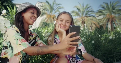 Attractive young women using face mask online in social media on smartphone Stock Footage 138501322
