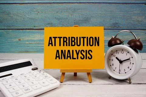 Attribution Analysis text written on paper card with calculator and alarm c.. Stock Photos