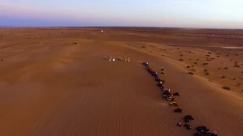 ATV and dune buggies completing a race in the desert Stock Footage 99158527
