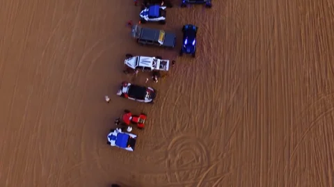 ATV and dune buggies lined up to race Stock Footage 99158459
