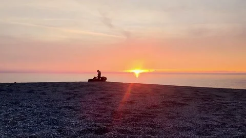 ATV on the Background of the Sunset on the Island. Quad Bike Rides. Stock Footage 225445791