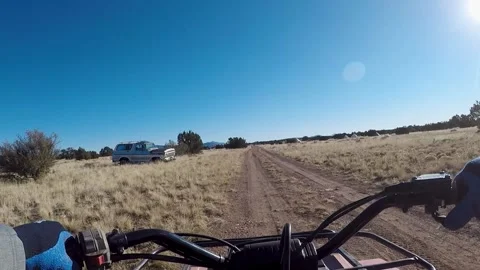 ATV On Bumpy Dirt Road- Slow Motion Stockbeeldmateriaal 312371150