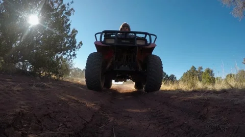 ATV Down Dirt Road &amp; Over Camera Stock Footage 312370221