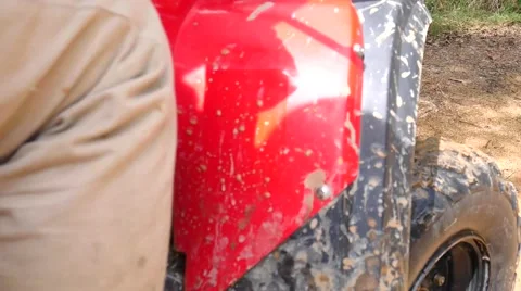 ATV drive through mud puddle Stock Footage 64331092