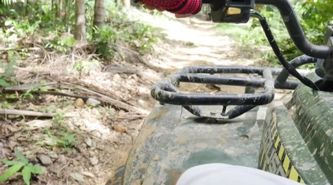 ATV drive through mud puddle Stock Footage 64331105