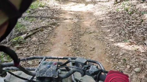 ATV drive through mud puddle Stock Footage 64331290