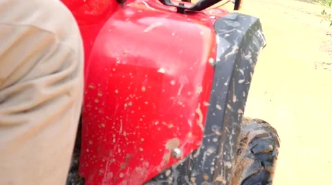 ATV drive through mud puddle Stock Footage 64331316