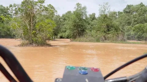 ATV drive through mud puddle Stock Footage 64331427