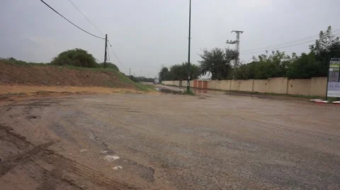 ATV drive through puddle in Netanya Israel street Stock Footage 56707201