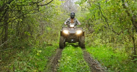 ATV Driving Through Woods Down Trail Stock Footage 281781692